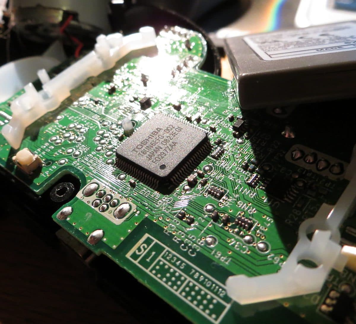 Console mainboard undergoing board-level repair